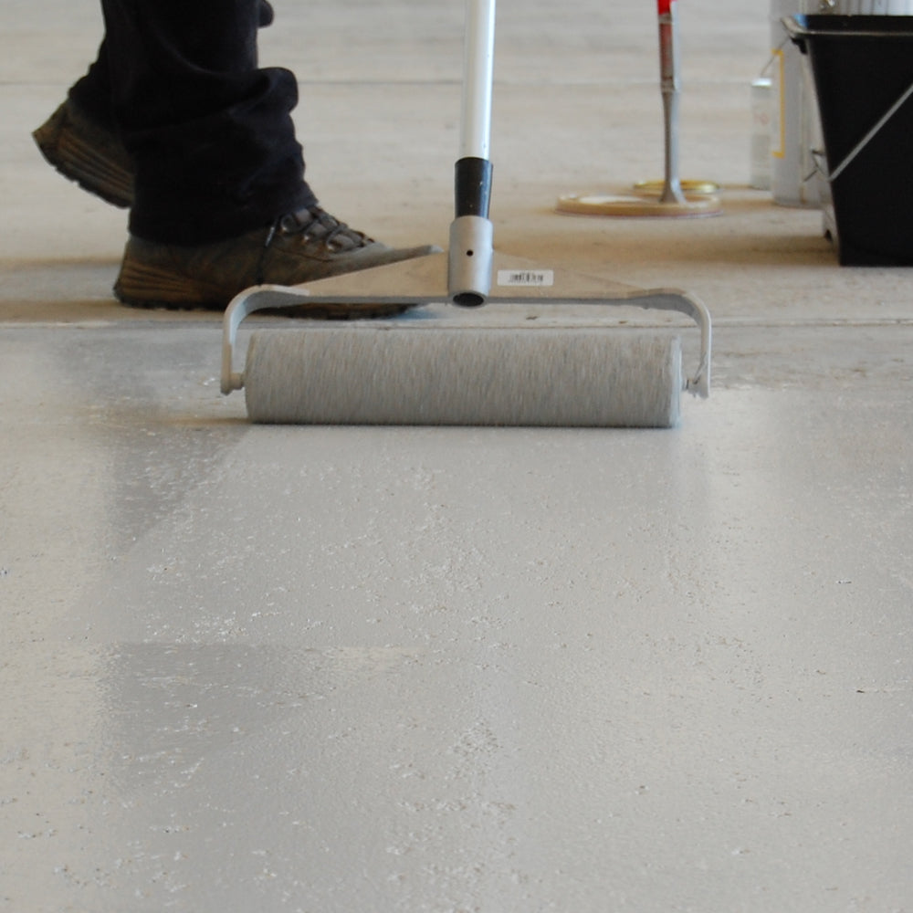 Painting Epoxy Floor Paint onto a garage floor with a roller