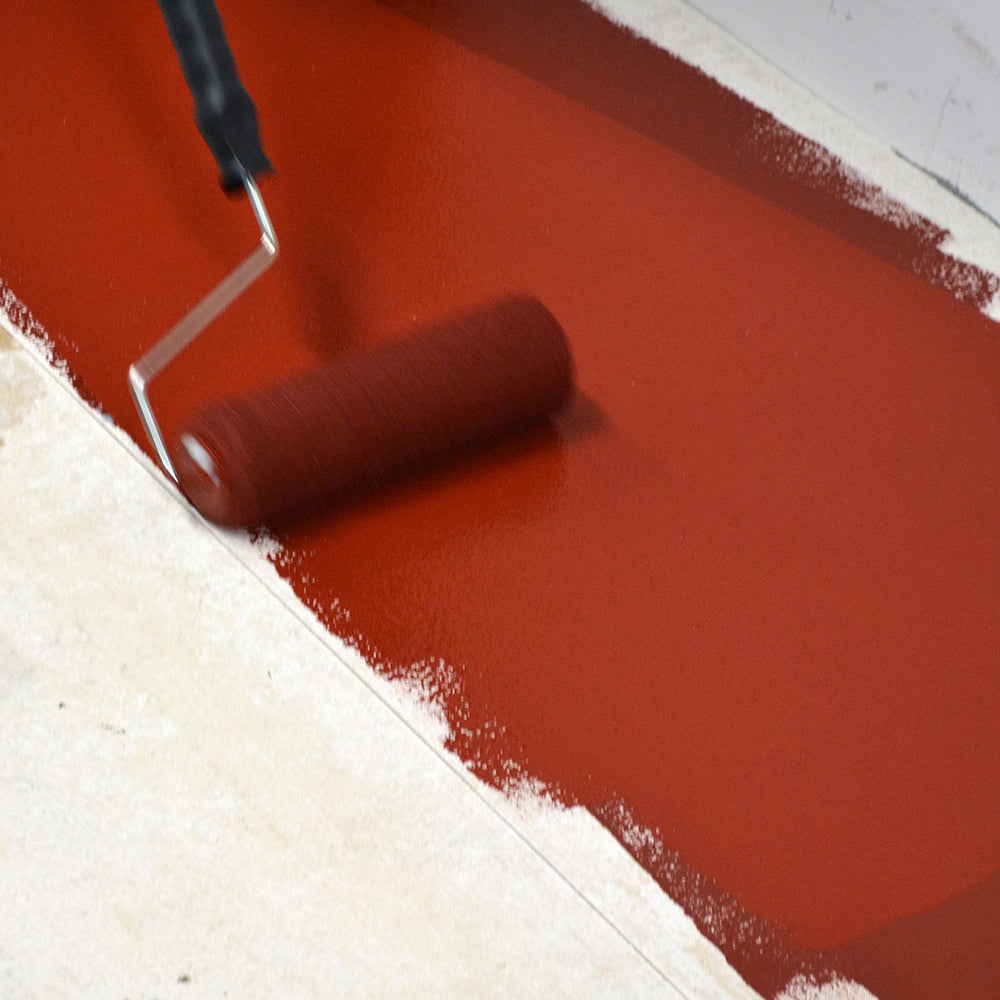 Painting Tile Red Epoxy Floor Paint Anti Slip onto a floor with a roller